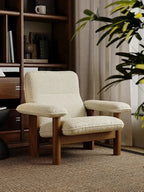 Kei Wood-Frame Lounge Chair, cream chair in a library setting
