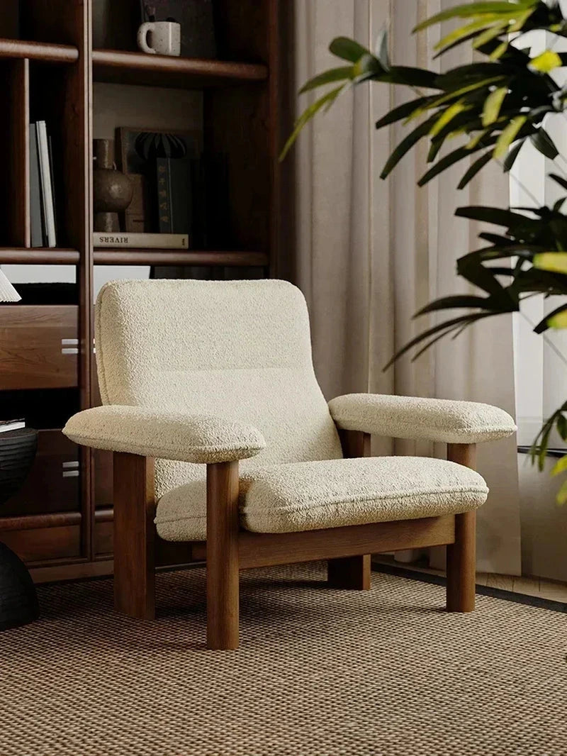 Kei Wood-Frame Lounge Chair, cream chair in a library setting