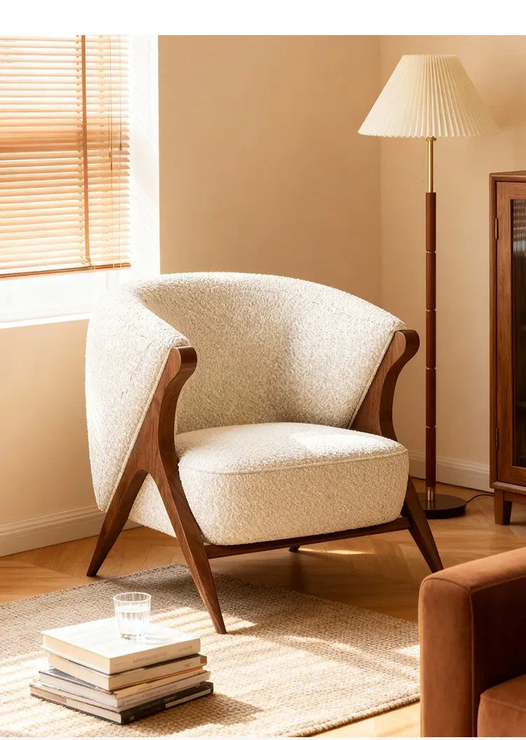 Ren Curved Lounge Chair, cream chair in a warm interior