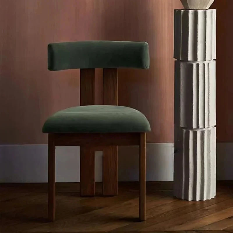 Tori Architectural Dining Chair, green upholstery in a styled interior