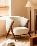 Ren Curved Lounge Chair, cream chair in a warm interior