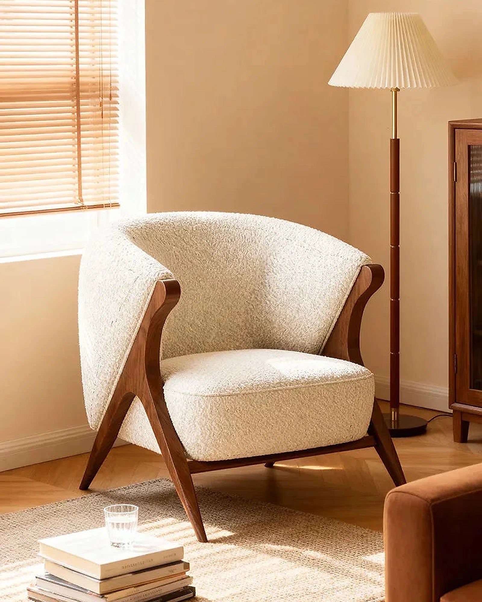 Ren Curved Lounge Chair, cream chair in a warm interior