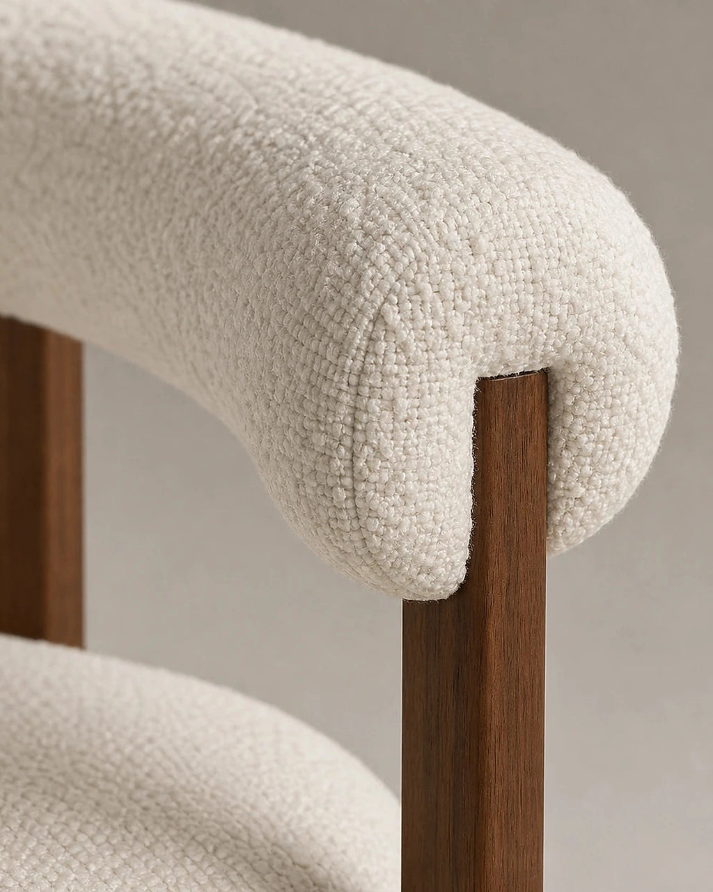 Sora chair cream upholstery and walnut post detail