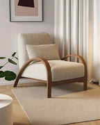 Yori Curved Wood Lounge Chair, beige chair in a bright interior